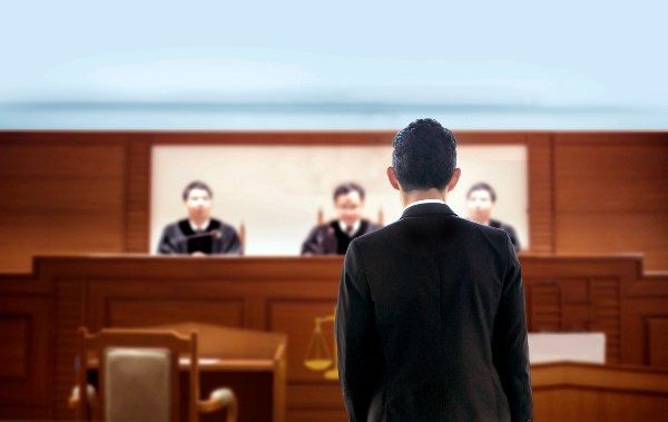 A lawyer stands in a court room in Denver