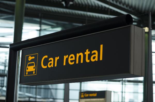 A car rental sign at a Denver airport