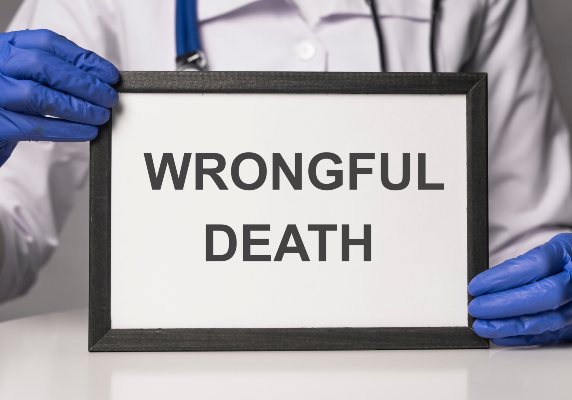 A doctor holds a wrongful death picture in a Denver hospital