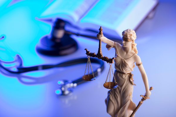 Blind justice statute on a Denver lawyers desk 